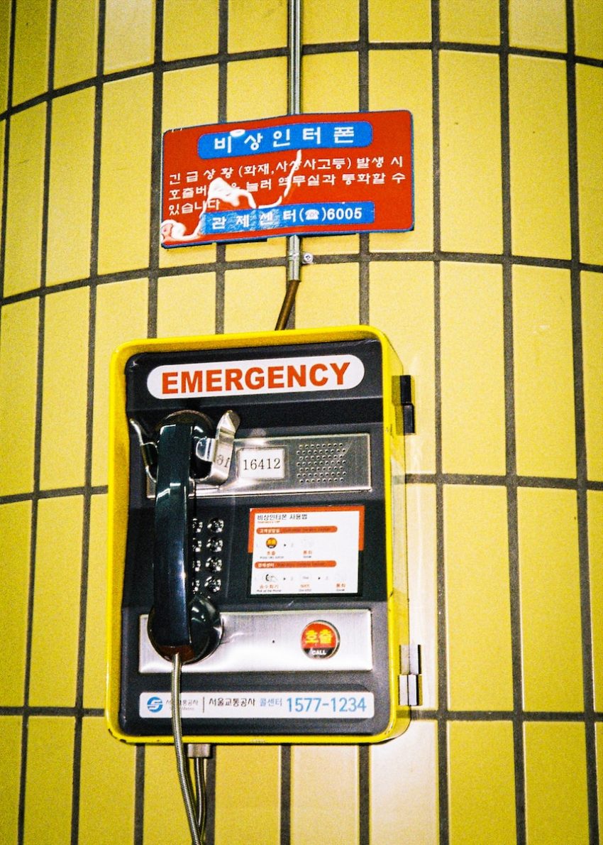 an emergency phone is attached to a wall